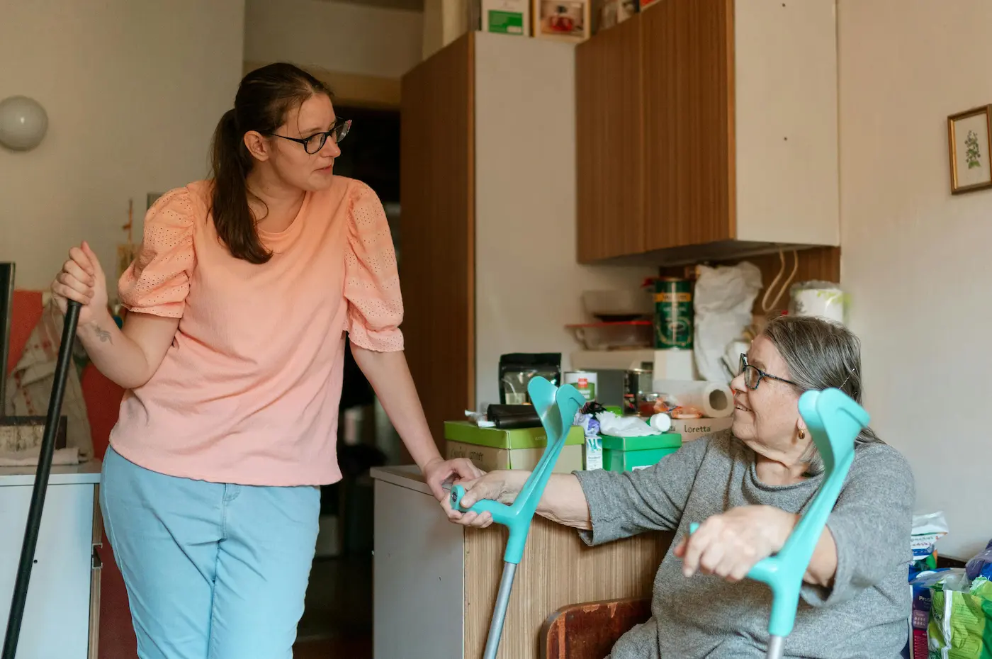 Homecare health worker talking with client after grocery shopping errands